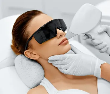 Close-up of laser hair removal being performed on a woman's upper lip.