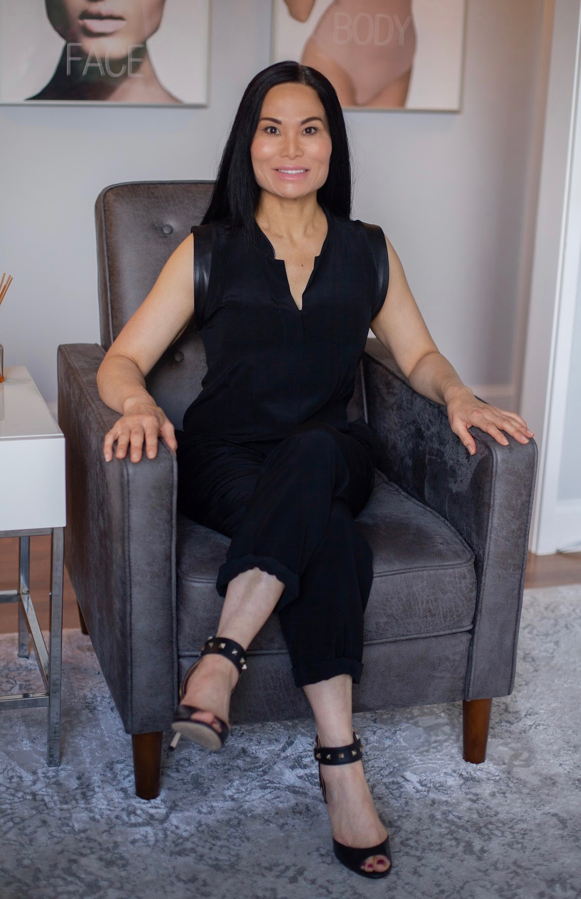 In the tranquil waiting room of fabEsthetics, Becky Pfeifer sits poised in a stylish chair, gazing calmly ahead