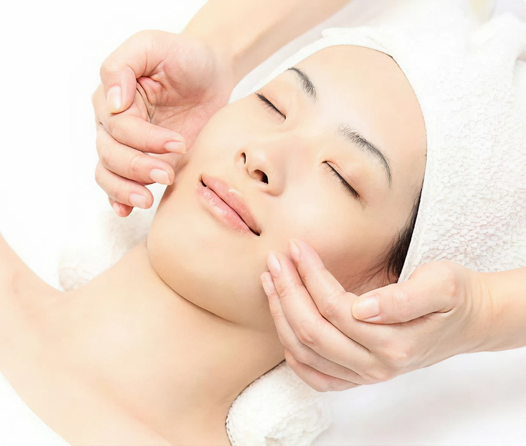 Woman receiving a facial treatment